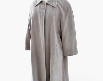 May include: A long, gray, wool coat with a button closure and a collar.
