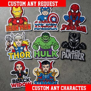 May include: A collection of eight embroidered patches featuring Marvel comic book characters including Iron Man, Captain America, Spider-Man, Thor, Hulk, Black Panther, Black Widow, and Doctor Strange, each with their name printed below the figure.