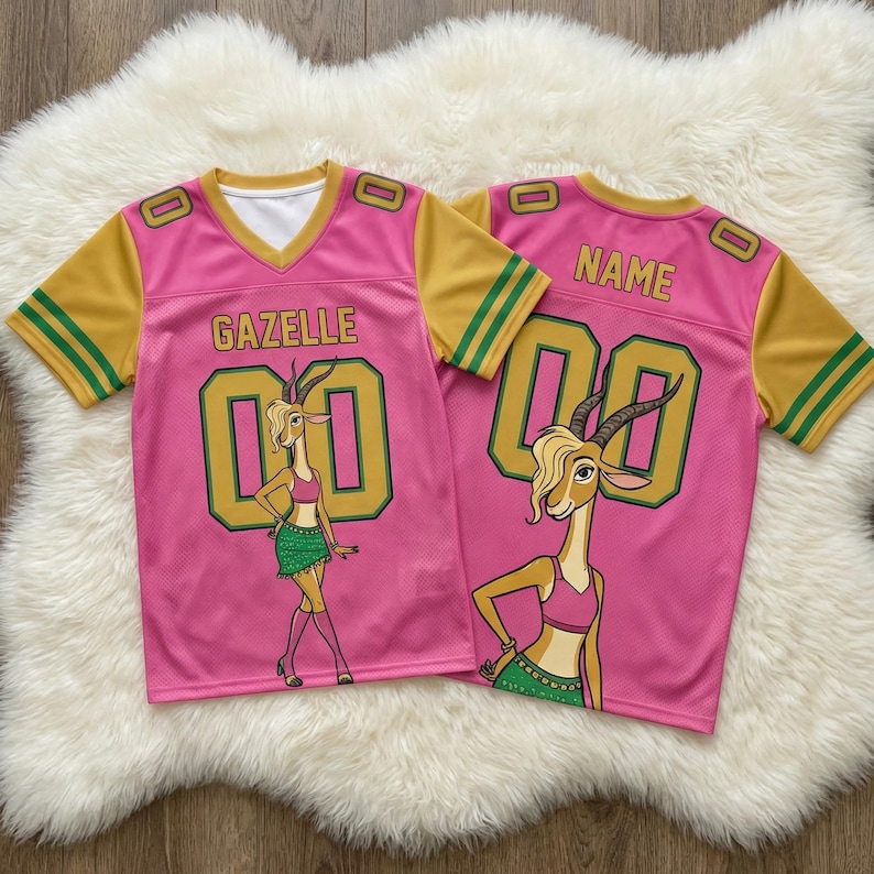 May include: Pink jersey with yellow sleeves and green stripes. The jersey features the name "GAZELLE" and the number "00" in gold. A cartoon gazelle is on the front. The back of the jersey has the word "NAME" and the number "00".