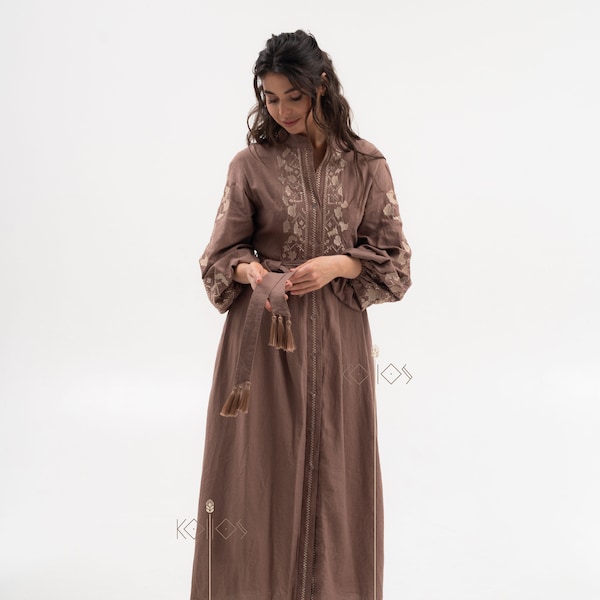 Ukrainian vyshyvanka made of brown linen, dressed with long sleeves, bronze embroidery.