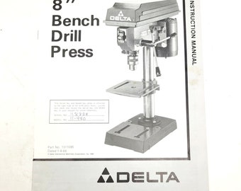 May include: Black and white instruction manual for an 8" Delta bench drill press. The manual includes a diagram of the drill press and the text "INSTRUCTION MANUAL".