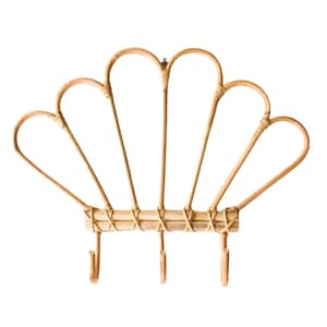 May include: A natural woven bamboo wall mounted coat rack with three hooks. The rack is shaped like a fan with a woven base.