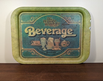 May include: Green metal serving tray with a vintage design featuring the text "The Warm & Wonderful Beverage Company" and the slogan "The Best Drinks Sold - Hot or Cold - Since 1891".