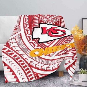 May include: Red, white, and gold throw blanket with a tribal pattern and the Kansas City Chiefs logo. The logo features the letters "KC" in red and white with a red arrowhead behind it. The words "Chiefs" are in gold letters.