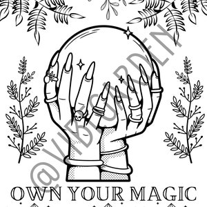 May include: Black and white illustration of hands holding a crystal ball, adorned with rings and long nails. The phrase "OWN YOUR MAGIC" is below the hands, with crystal illustrations at the bottom. Decorative floral elements frame the top.