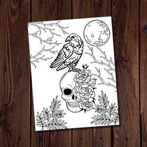May include: A black and white line drawing of a crow perched on a skull with roses. The crow is facing left and the skull is facing right. The roses are in bloom and have a detailed design. The background is a simple design of branches and a full moon.