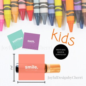 May include: Printable digital download of three 2x2 inch labels for essential oil bottles. The labels are pink, purple, and green with white text. The text on the labels reads "sniffles", "ouch", and "smile". The labels are designed for children.