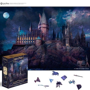 May include: A Harry Potter wooden jigsaw puzzle featuring Hogwarts Castle under a night sky. The puzzle box is dark blue and gold, with the Harry Potter logo and the number 338. Several wooden puzzle pieces are scattered around the box.