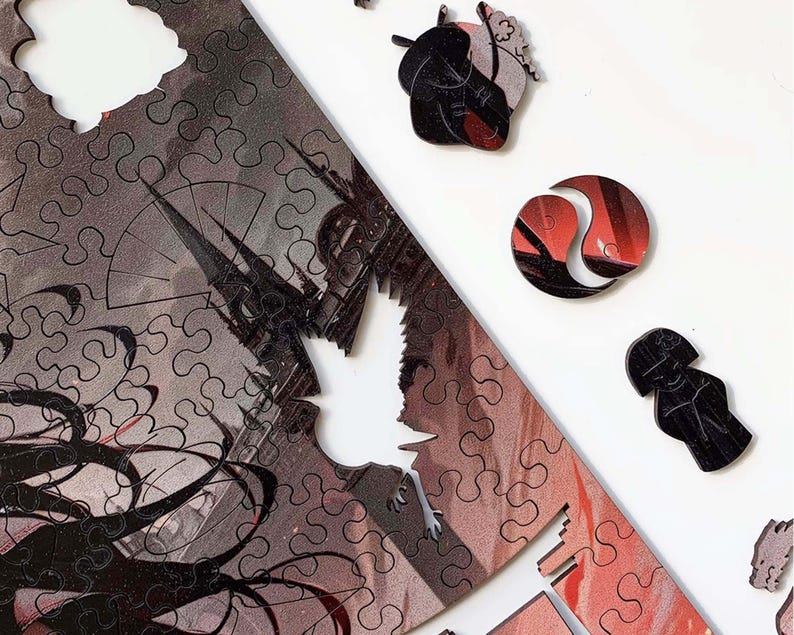 May include: A black and white jigsaw puzzle with a red and white design. The puzzle is partially assembled and shows a woman with long black hair, a cityscape, and a yin yang symbol.
