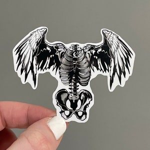 rib cage with love heart and devil wings' Sticker