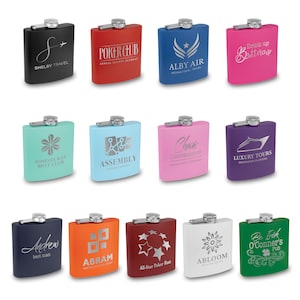 May include: Twelve different colored hip flasks with various engraved designs. The flasks are made of stainless steel and have a silver cap. The designs include text, logos, and graphics.