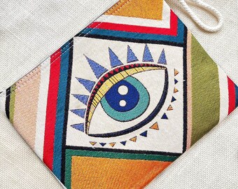 Handgemaakt etui met ritssluiting en boze oog-motief: boho clutch handtas