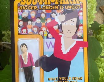 May include: A South Park action figure of Brian Boitano in a red and white figure skating outfit. The figure is packaged in a black and yellow box with the words "South Park" and "Bigger, Longer & Uncut" on it. The box also has a warning label that says "Choking Hazard. Adult collectible, not a toy."