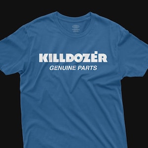 May include: A blue t-shirt featuring the white text "KILLDOZER GENUINE PARTS". The shirt has a crew neck and short sleeves. The brand logo "midnight climax" is at the top of the shirt.