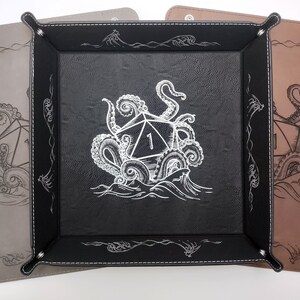 Three Kraken dice tray design options: gray with black, black with silver, dark brown with black