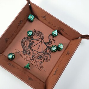 Kraken dice tray pulling down d20 into ocean