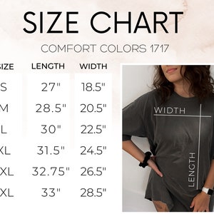 May include: Size chart for Comfort Colors 1717 t-shirts. The chart shows sizes S to 3XL with corresponding length and width measurements in inches. A person is wearing a gray t-shirt, with the length and width of the shirt highlighted.