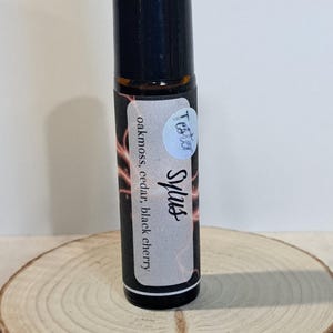 Perfume Sylus en forma de bola rodante