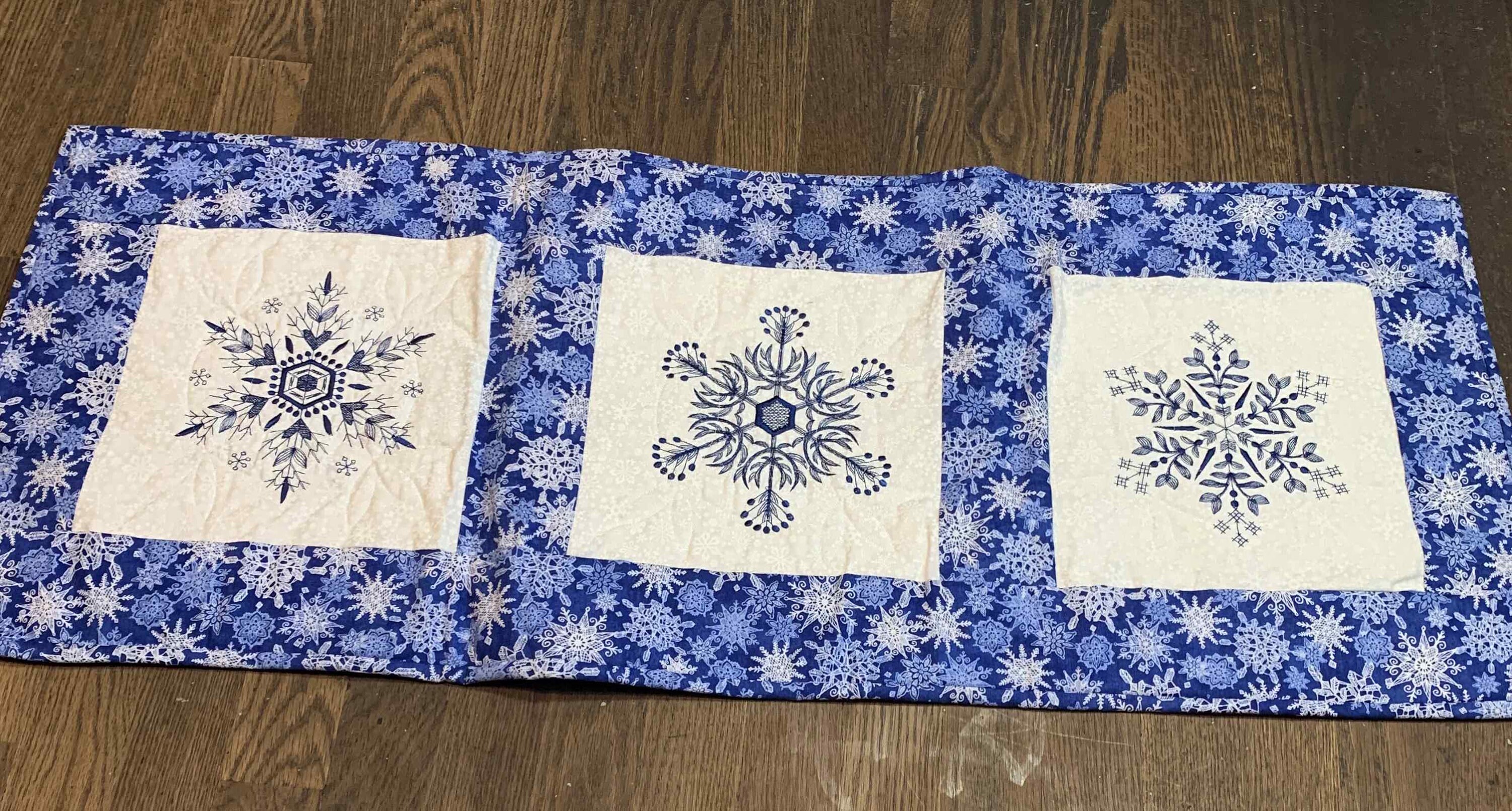 Embroidered Snowflake Table Runner: Quilted Reversible Christmas Decor