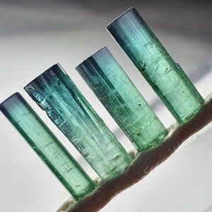 Ink blue cap terminated bluish tourmaline crystals