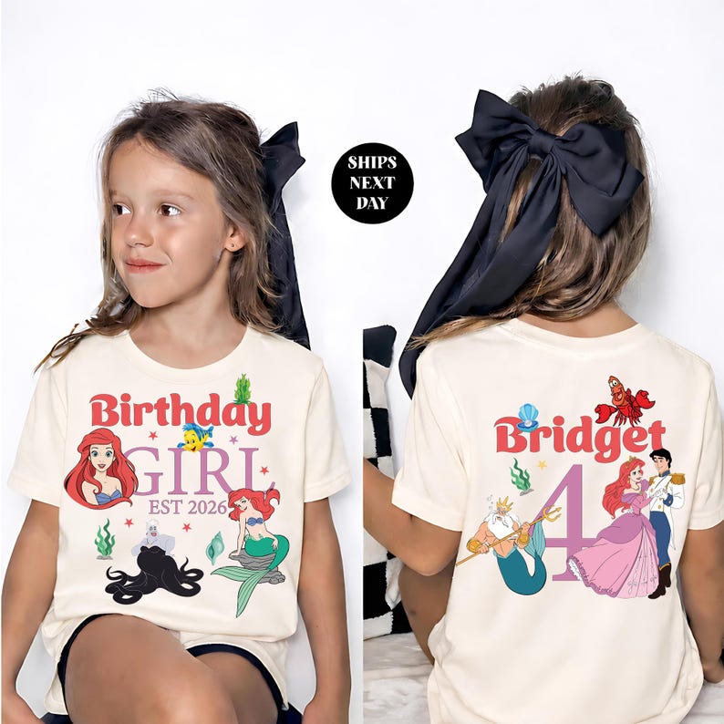 a young girl wearing a white t-shirt with a Disney character design and text.