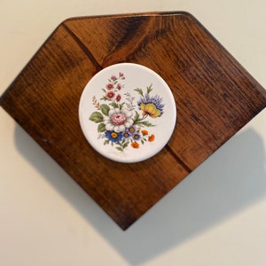 Beautiful handmade wooden wall hanger adorned with ceramic tile with beautiful floral motif
