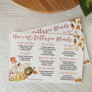 May include: A printable card with a watercolor background of fall leaves. The card lists different essential oil diffuser blends for the fall season, including Crisp Fall Day, Snuggle, Spiced Chai, Sweater Weather, Apple Pie Spice, Pumpkin Spice, Snickerdoodle, and Crunchy Leaves. Each blend lists the essential oils and the number of drops to use.