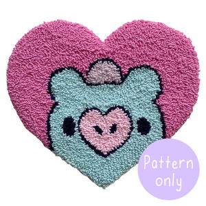May include: A pink heart-shaped rug with a light blue cartoon animal face in the center. The animal has a pink heart nose and black eyes. The text "Pattern only" is written in white on a purple circle.