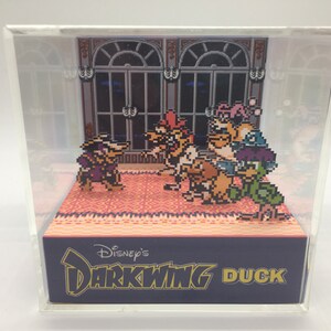 May include: A 3D diorama of the Disney's Darkwing Duck video game. The diorama features the main characters from the game, including Darkwing Duck, Launchpad McQuack, and the villainous Negaduck. The diorama is set in a room with a large window and a patterned carpet.