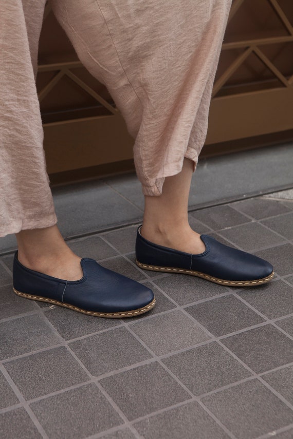 black flat slip ons