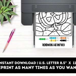 May include: Printable color by number activity sheet featuring a Halloween pumpkin design. The sheet is 8.5 inches by 11 inches and includes a color key with five different colors.