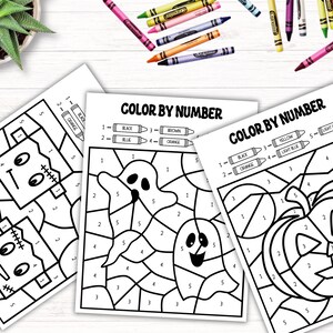 May include: Three printable Halloween color by number activity sheets featuring a Frankenstein monster, two ghosts, and a jack-o-lantern. Each sheet has a color key with numbers and crayon colors.