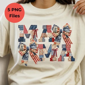 May include: A cream-coloured t-shirt featuring the word MAMA in a patchwork design. The letters are composed of various red, white, and blue fabric patterns, including stars and stripes, accented with decorative bows and small red ribbons.