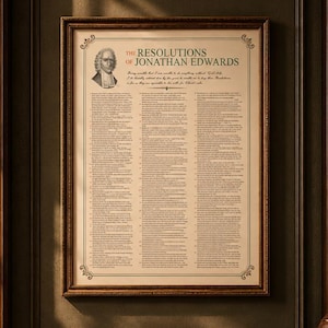 May include: A framed wall print titled The Resolutions of Jonathan Edwards, featuring a portrait of Jonathan Edwards and a list of numbered resolutions printed in black text on a cream-colored background with a decorative border.