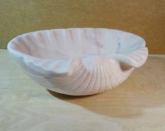 Large marble shell. Shell as a stone sculpture. Large shell made of real natural stone.