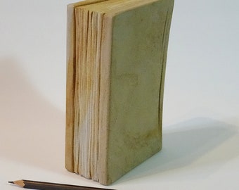 Book made of light sandstone. A decorative object for house and garden.