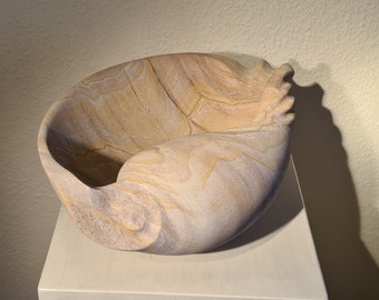 Snail shell as decoration, large snail shell made of sandstone, snail shell, shell made of stone, vessel made of sandstone, snail made of stone.