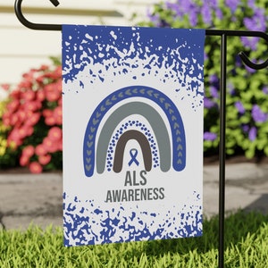 May include: A blue and white garden flag with a rainbow design and the text "ALS AWARENESS". The rainbow is made of gray and brown stripes with a blue ribbon in the center.