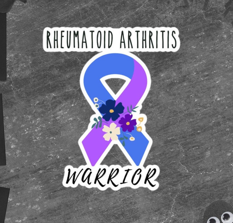 May include: A blue and purple ribbon with flowers, the words "Rheumatoid Arthritis Warrior" are written on the sticker.