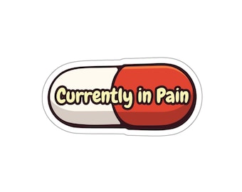 May include: A sticker in the shape of a pill, with a white and red color scheme. The text "Currently in Pain" is written in a playful font, adding a touch of humor to the design.