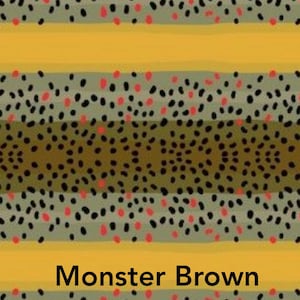 May include: A close-up of a fabric pattern with alternating stripes of yellow, green, and brown. The pattern features black and red dots. The text "Monster Brown" is printed at the bottom of the image.