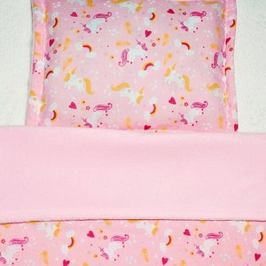 Dolls pram cot bedding set blanket and pillow. Pink unicorn pattern with baby pink fleece reverse