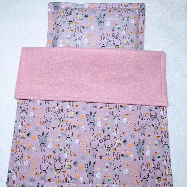 Dolls pram cot bedding set blanket and pillow. Cute bunnies on mauve with pink fleece