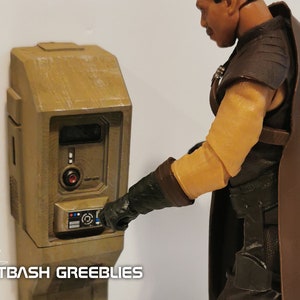 May include: A beige wall-mounted control panel with a red button and a small digital display. A person's hand is pressing a button on the panel.