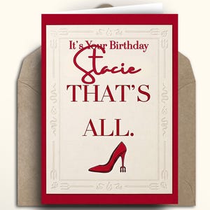 May include: A birthday card with a red border and a cream interior. The card reads "It's Your Birthday Stacie THAT'S ALL." A red high-heeled shoe is at the bottom. The card is inside a brown envelope.