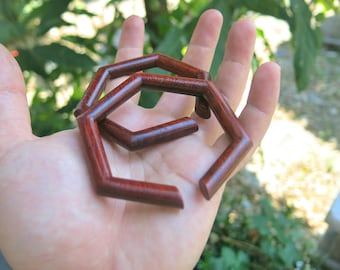 A Pair of Blood Wood Hexagon Hanging Hoop Gauged Ear Plugs