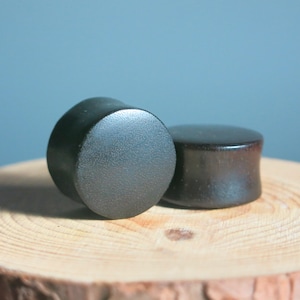 A Pair of Minimalist Black Wood Ear Plugs for Ear Stretching. Organic Body Jewelry for Stretched Earlobes. Custom Double Flare Ear Plugs.