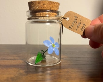 Paper Forget-Me-Not in a bottle
