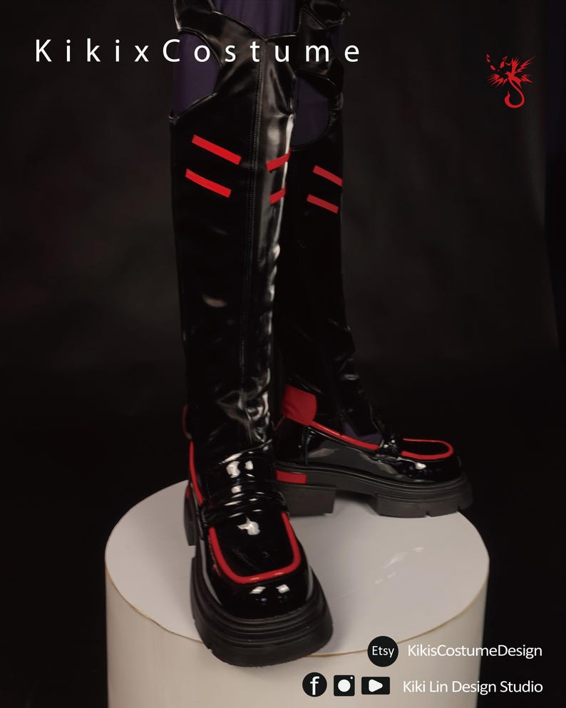 May include: Black patent leather boots with red trim and a chunky platform sole. The boots have a loafer style with a strap across the top. The boots are on a white pedestal.