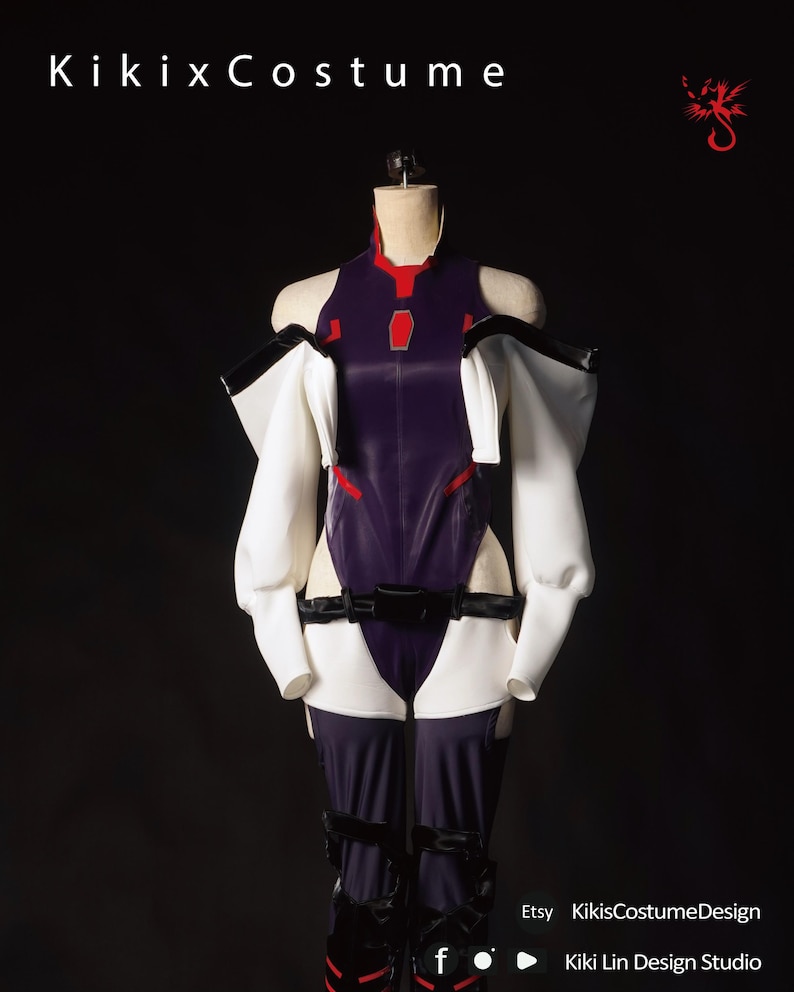 May include: A purple and white cosplay costume with a black belt and red accents. The costume is on a mannequin against a black background. Kiki x Costume.